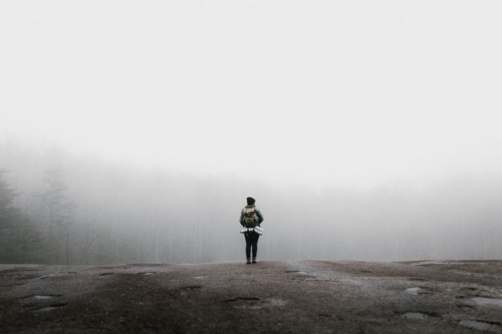 a person standing in the middle of nowhere